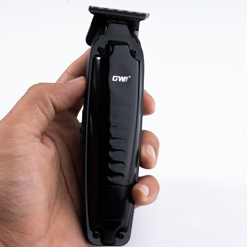 ماشین اصلاح موی سر و صورت جی دبلیو مدل GW-9979، اصلاح به صورت صفر زن، خط زن، منبع انرژی باتری، تکنولوژی اصلاح به صورت تریمر، مدت زمان شارژ 120 دقیقه و مدت زمان استفاده پس از شارژ 120 دقیقه، به همراه کابل شارژ، برس تمیزکننده، روغن، 4 عدد شانه، عملکرد توربو - Image 8