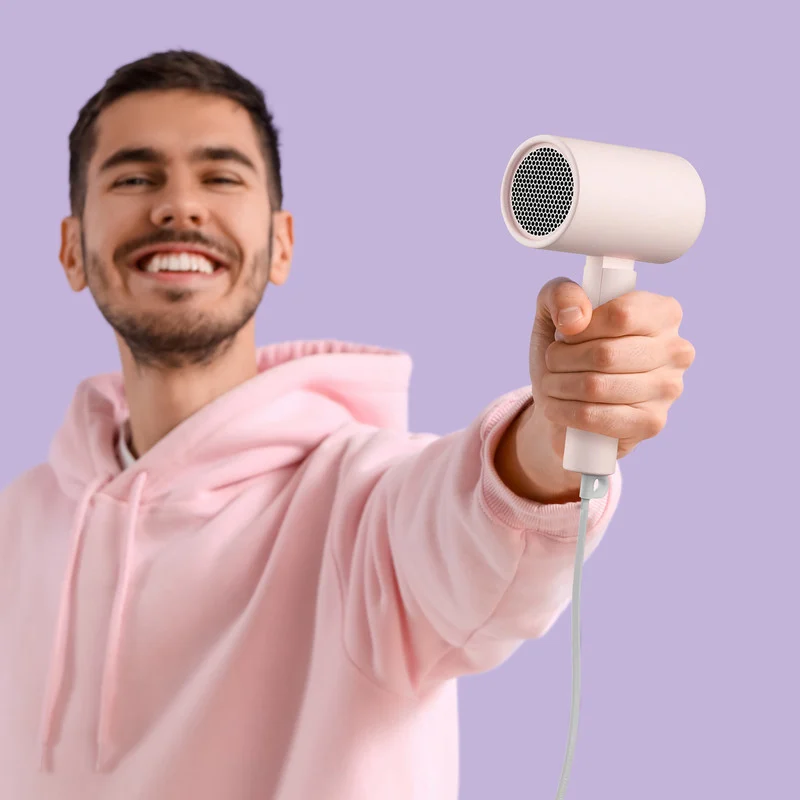 سشوار مسافرتی خانگی شیائومی مدل CMJ04LXEU، موتور AC با توان مصرفی 1600 وات، دارای قابلیت باد سرد، فناوری تولید یون و نرم کنندهی یونی، با حالت صافکننده و حجمدهنده، تنظیم حرارت 2 حالته و کنترل سرعت 2 حالته، به همراه متمرکزکننده - Image 4