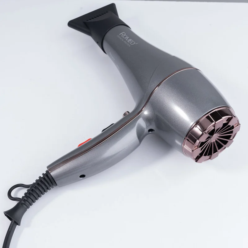 سشوار حرفهای رومئو مدل RM-5858، موتور AC با توان مصرفی 2200 وات، دارای قابلیت باد سرد، طراحی ارگونومیک، دارای حلقه آویختن، با حالت صافکننده و حجمدهنده، وزن 450 گرم، تنظیم حرارت 3 حالته و کنترل سرعت 2 حالته، به همراه متمرکزکننده باریک - Image 5